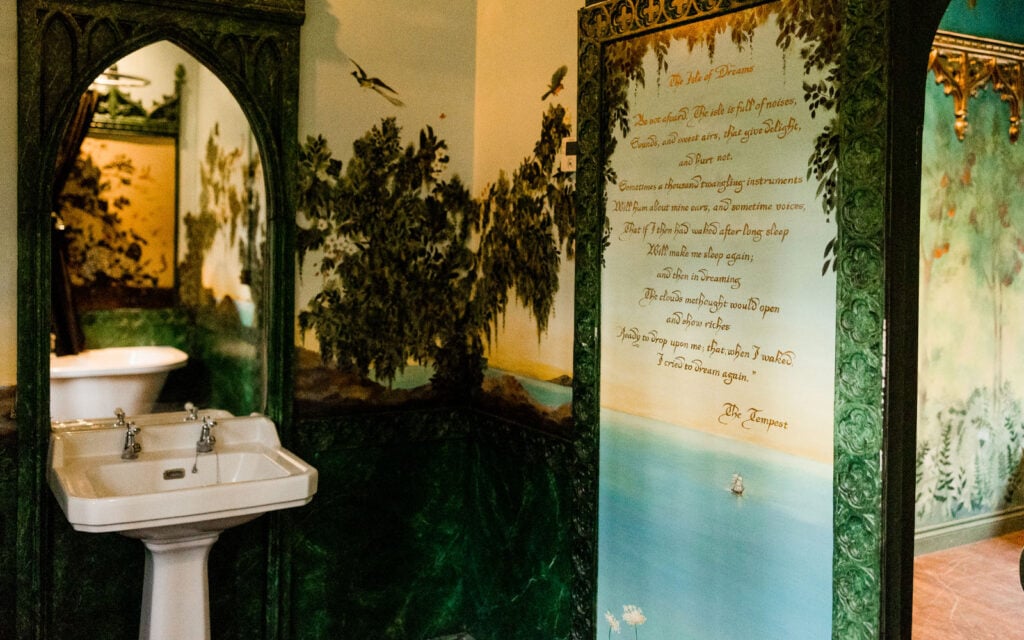Hand-painted woodland mural bathroom inside a Dreamery Hideaway bothy