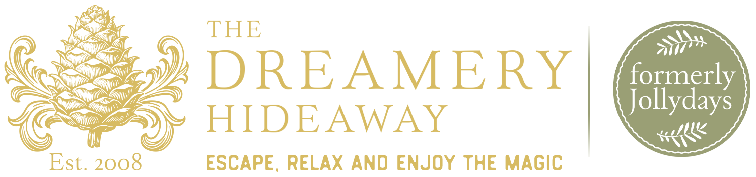 Dreamery Hideaway logo with gold pinecone emblem and formerly Jollydays badge.